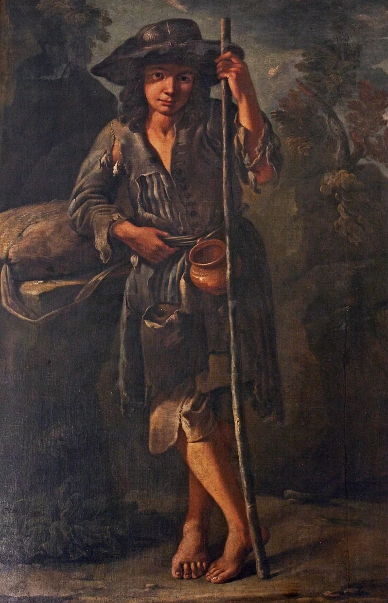 Mendicante appoggiato ad un bastone
